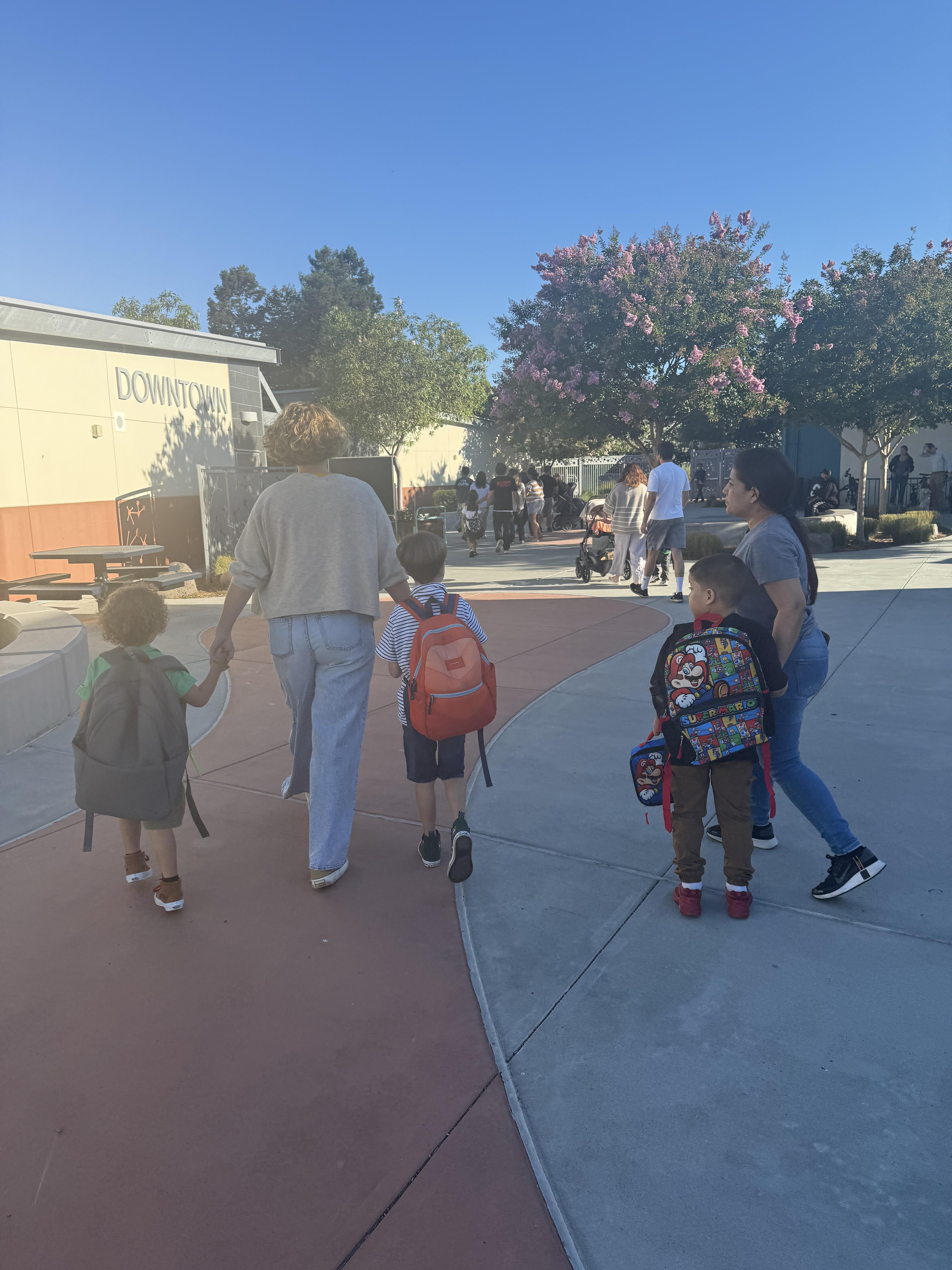 Parents walking students to class on the first day of school