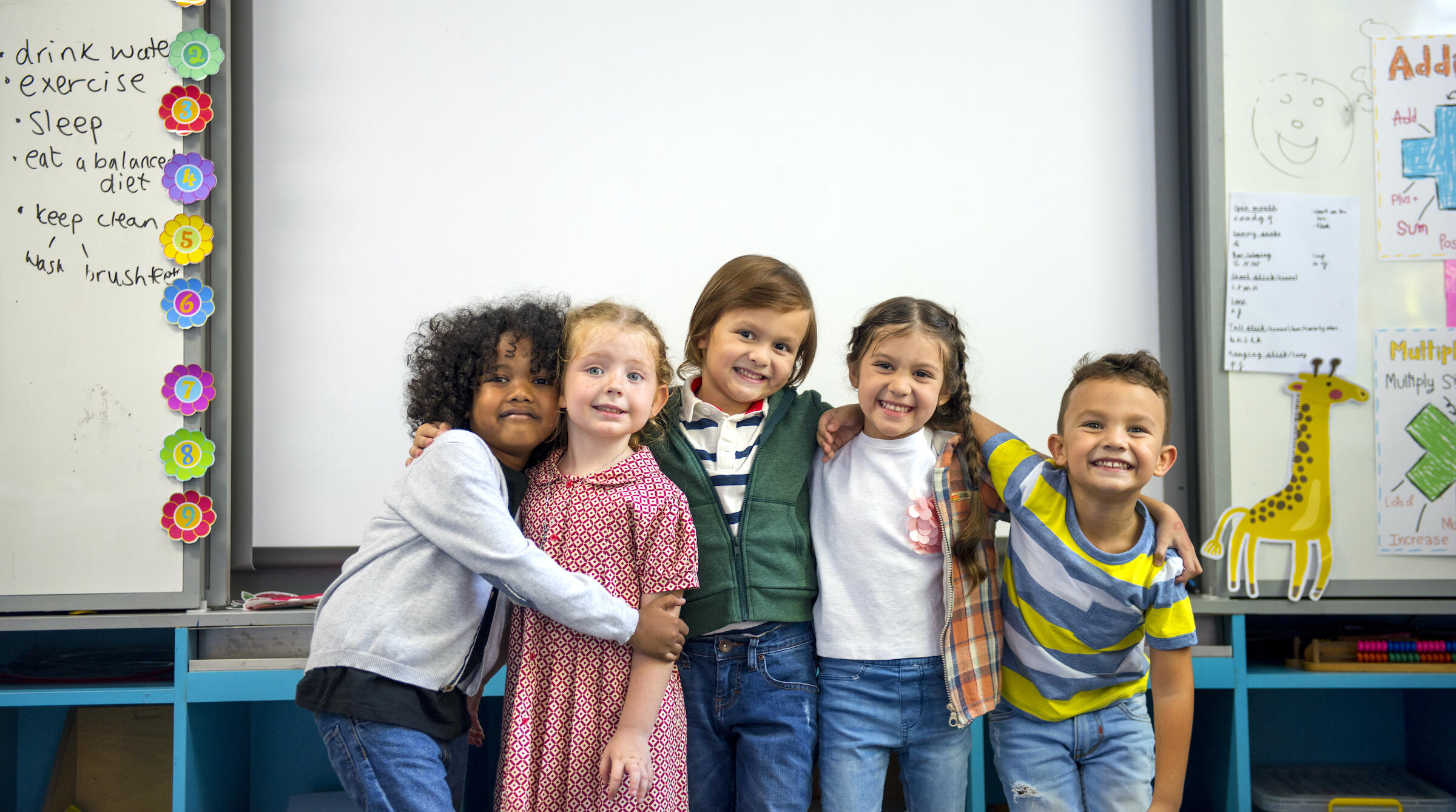 happy young students - ethnically diverse