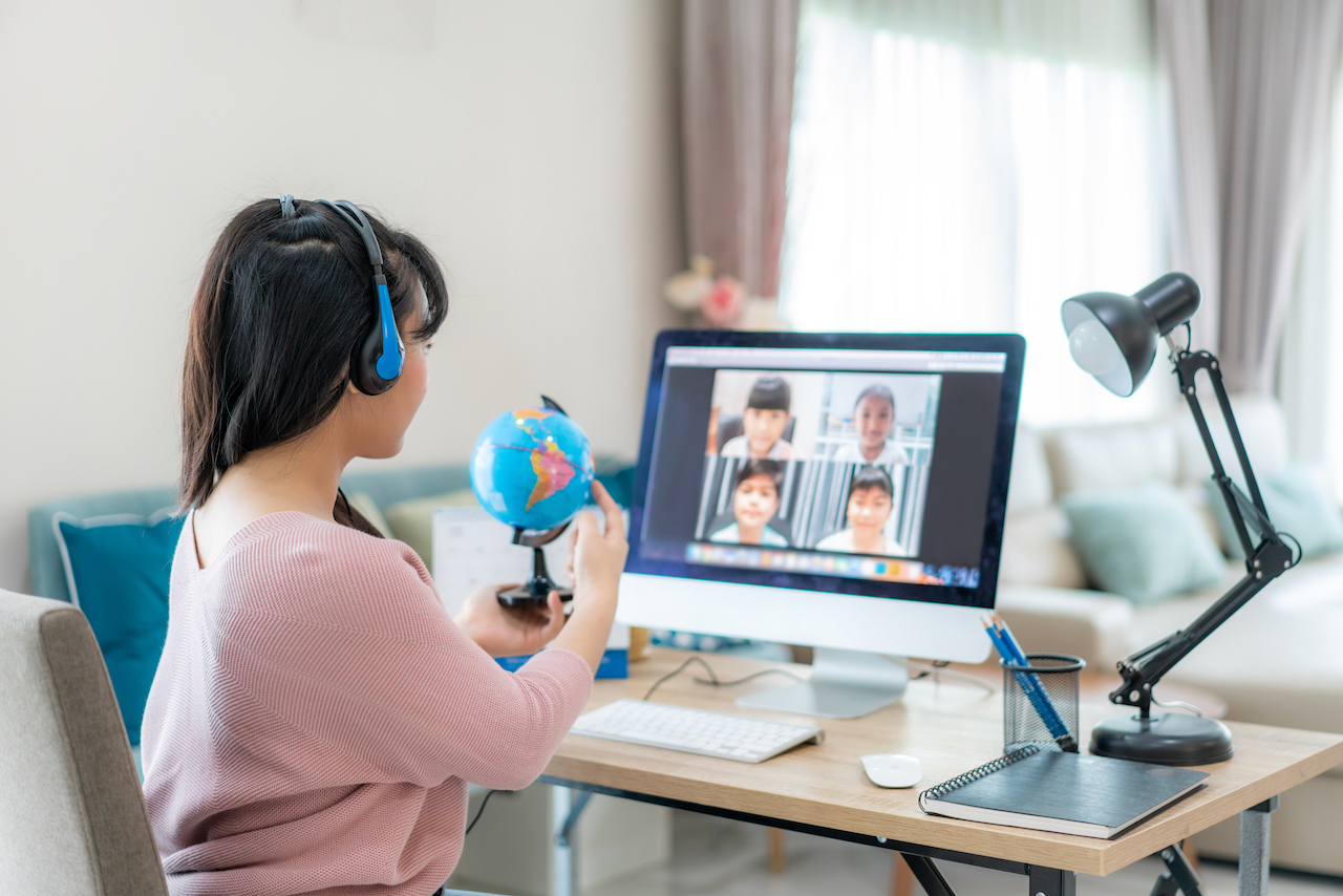 girl learns at home via computer