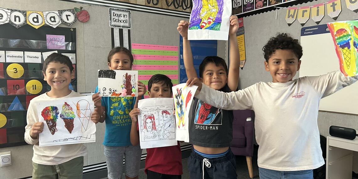 Expanded Learning students proudly display their summer art projects.