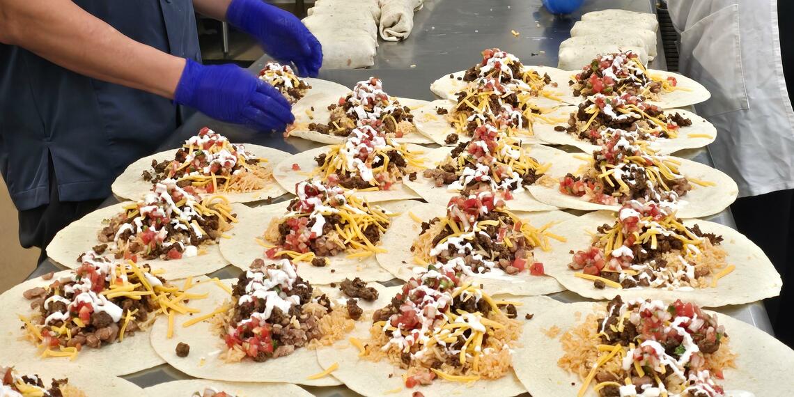 Photo of central kitchen folding burrittos