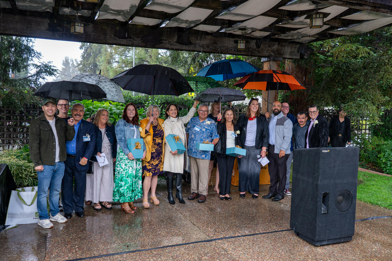 CUSD's 2026 retirees gather together in the rain for a retirement celebration