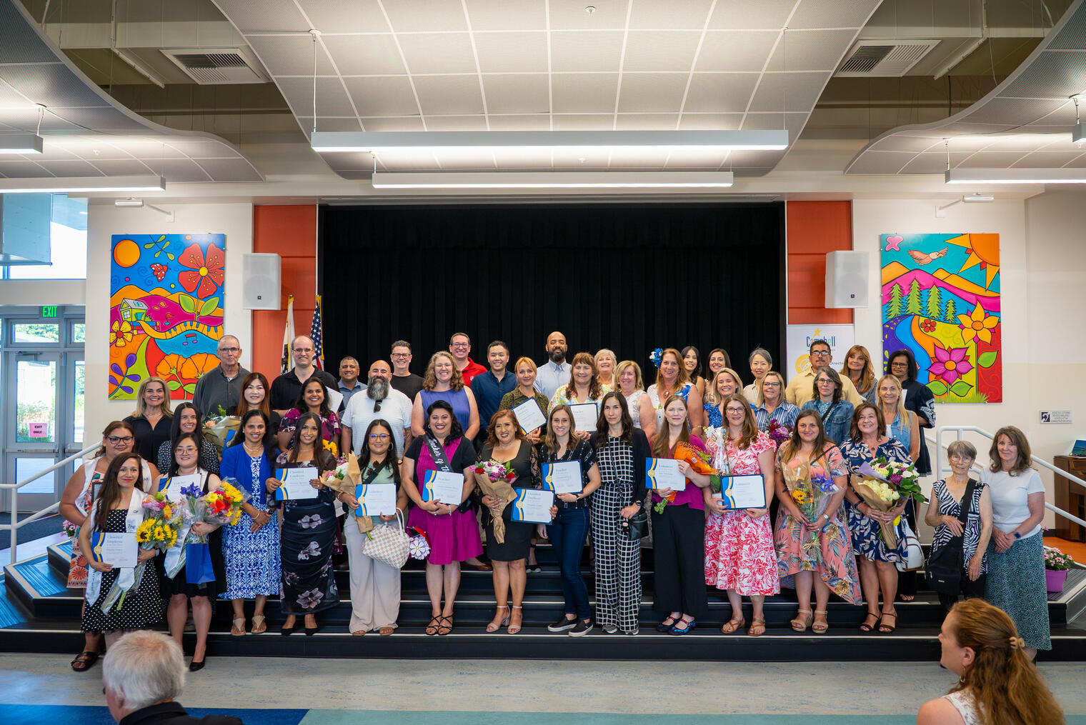 Honorees from the May 2026 staff and volunteer recognition ceremony