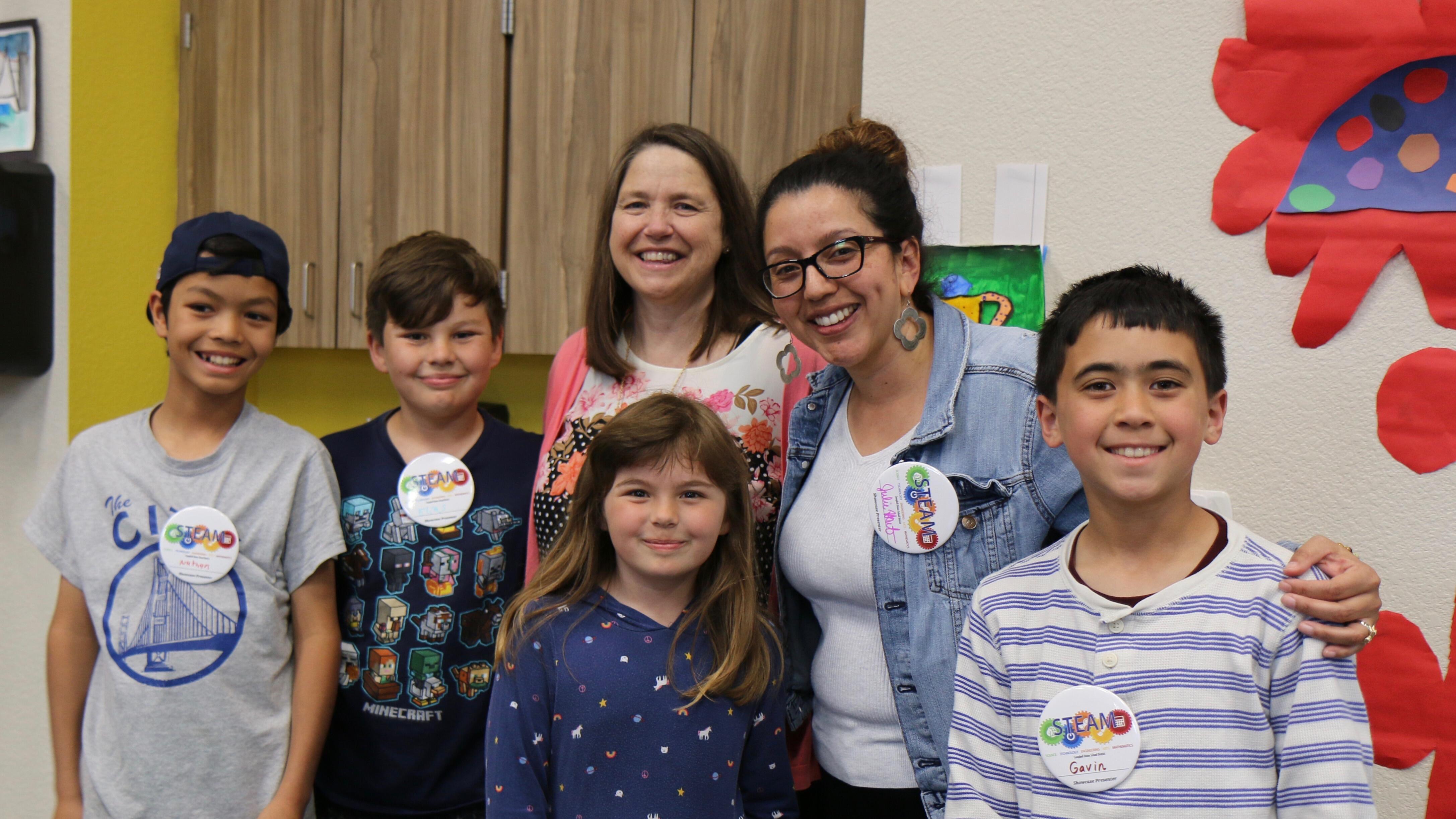 happy students with teacher